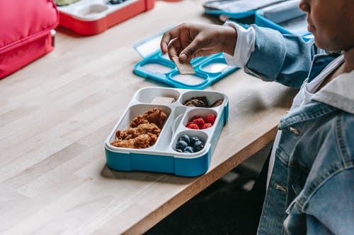 A kid eating school lunch