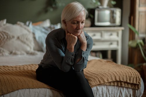 A woman sitting on a bed