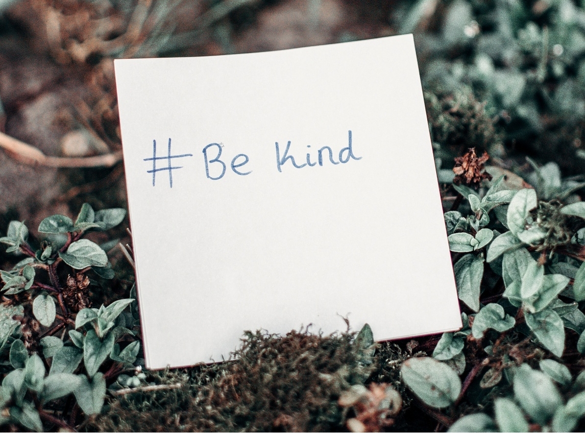 "Be kind," written on a piece of paper