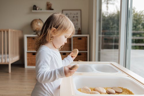 A child playing with rocks