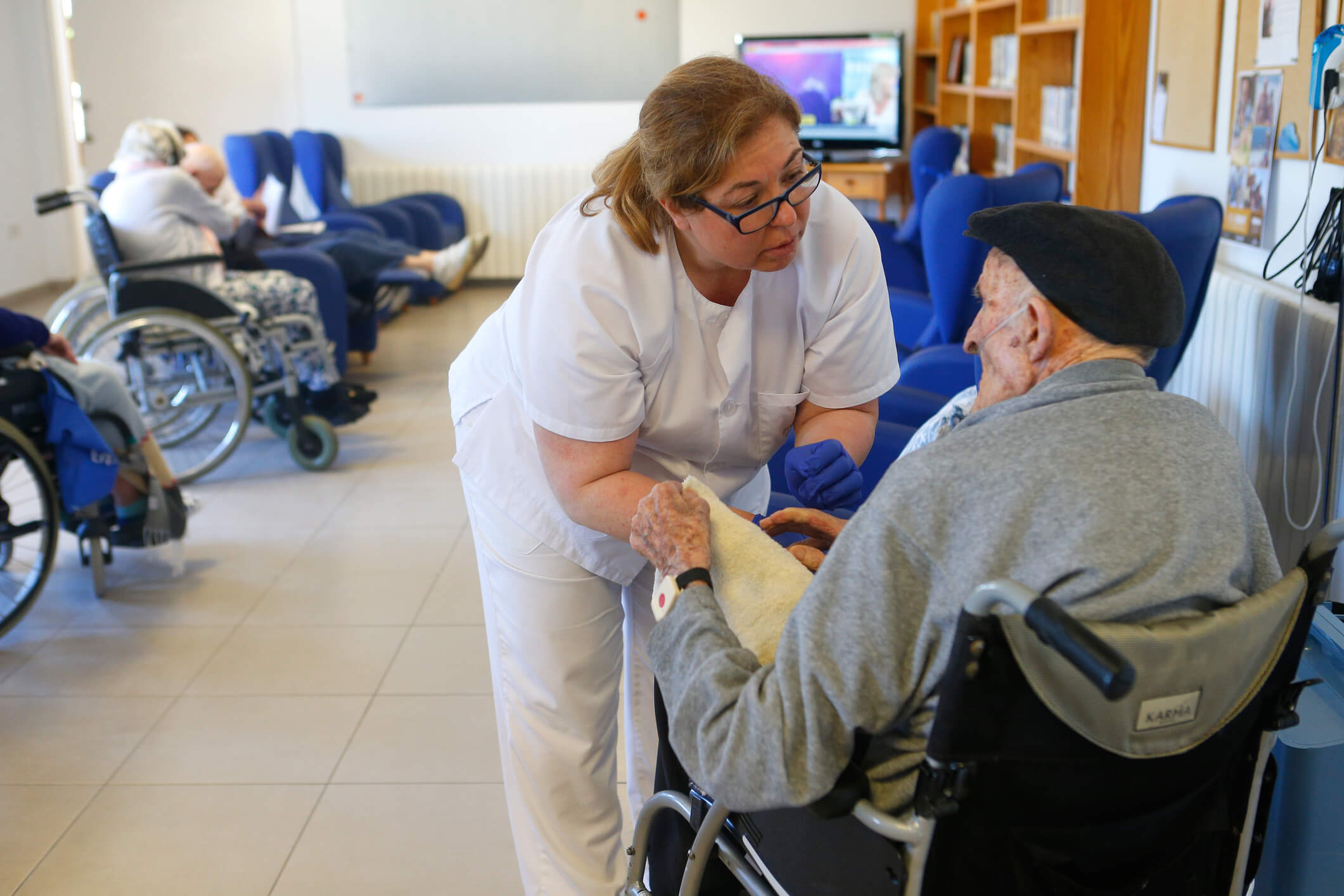 Nurse assisting the senior citizen