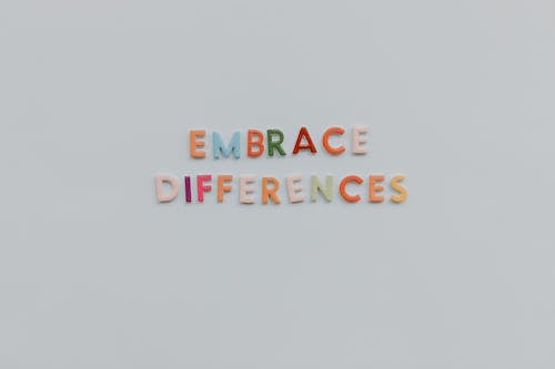 Embrace differences written using colored alphabets